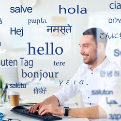 man at laptop with hello in translation