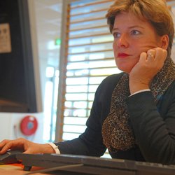 woman reading computer screen